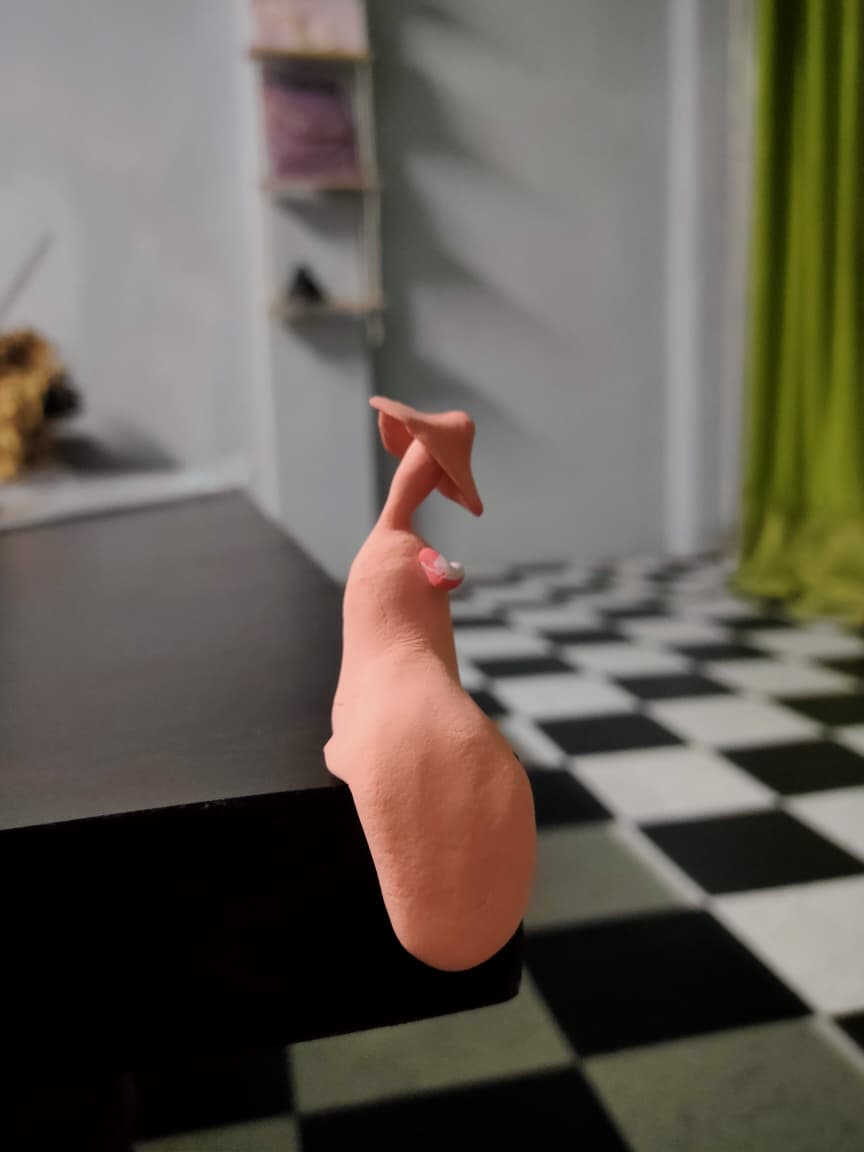 Clay bird sculpture