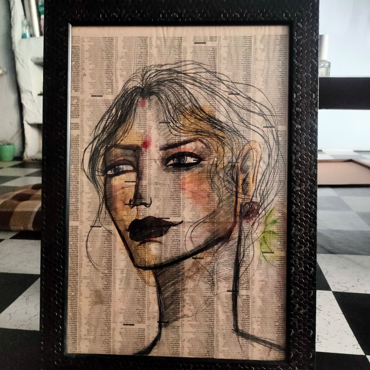 Framed portrait on newspaper